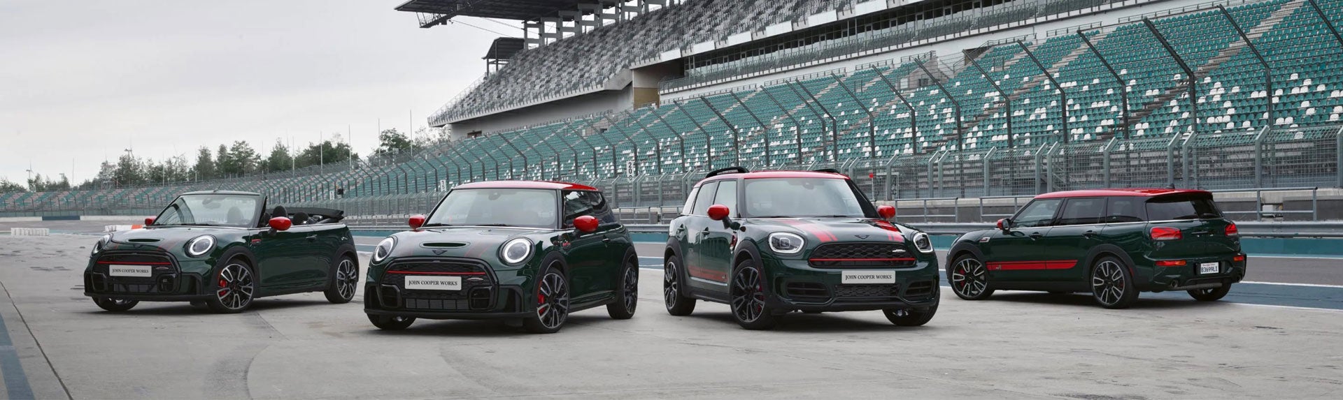 Family of four MINI John Cooper Works models parked on a race track. | MINIDemo1 in Derwood MD